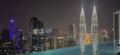 a view of a city skyline at night at Imperial Suites KLCC in Kuala Lumpur