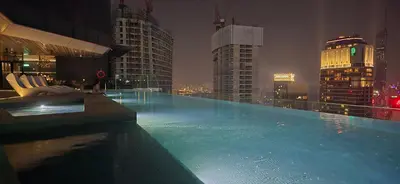 a large swimming pool on top of a building at Imperial Suites KLCC in Kuala Lumpur