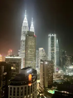 a city skyline at night with tall buildings at 2bedroom SOHO SUITE KLCC View by Homeizing in Kuala Lumpur