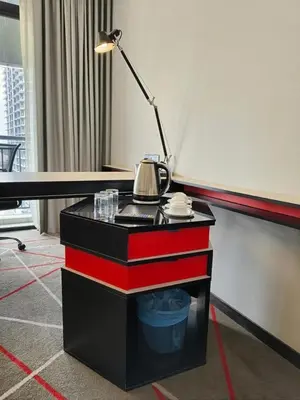 a table with a tea kettle on top of it at Suites at Maison 101,Heart Of KL City in Kuala Lumpur
