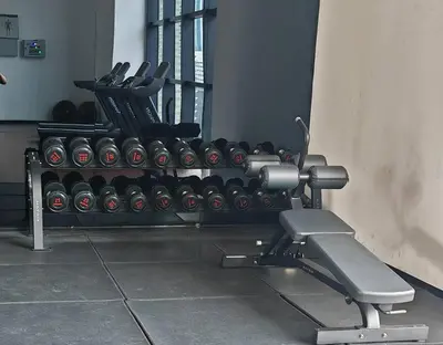 a gym with a row of dumbbells on a bench at Chambers A Studio Flat, KLCC & KL Tower ,view in City in Kuala Lumpur