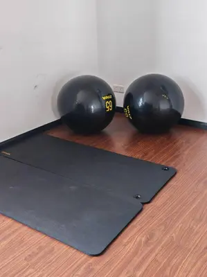 two black helmets sitting on top of a yoga mat at Chambers A Studio Flat, KLCC & KL Tower ,view in City in Kuala Lumpur