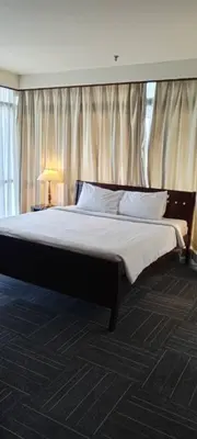 a bedroom with a large bed in a room at KL Apartment At Berjaya Times Square in Kuala Lumpur
