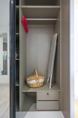a closet with a shelf with a basket and a knife at Urban KL Gem Perfect Getaway High Speed 100Mbps in Kuala Lumpur