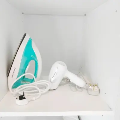 a white desk with a computer monitor and headphones on it at Urban KL Gem Perfect Getaway High Speed 100Mbps in Kuala Lumpur