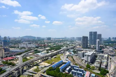 a city with a highway and a city with buildings at Exquisite KL Retreat Pool & Gym High Speed 100MB in Kuala Lumpur