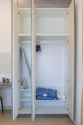 a white closet with shelves and a ladder at Continew TRX Corner House +2 Balconies +2 Rooms in Kuala Lumpur
