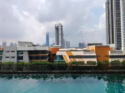 a view of a city with buildings and a body of water at Conveniently Located Trion KL Premium Amenities in Kuala Lumpur