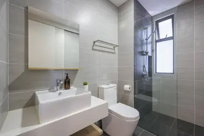 a white bathroom with a sink and a toilet at Conveniently Located Trion KL Premium Amenities in Kuala Lumpur