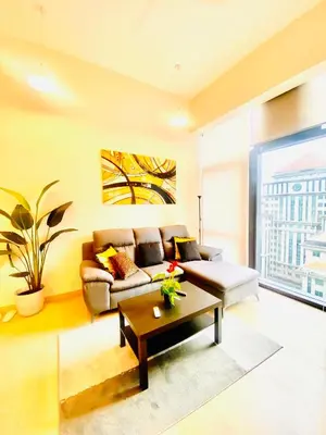 a living room with a couch and a coffee table at Eastern Suites Star KLcc in Kuala Lumpur