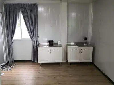 a room with two white cabinets and a window at Titiwangsa Cabin Retreats by uBook in Kuala Lumpur