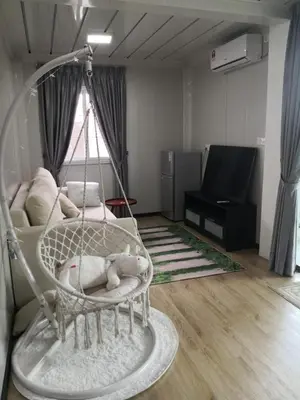 a room with a swing in a living room at Titiwangsa Cabin Retreats by uBook in Kuala Lumpur