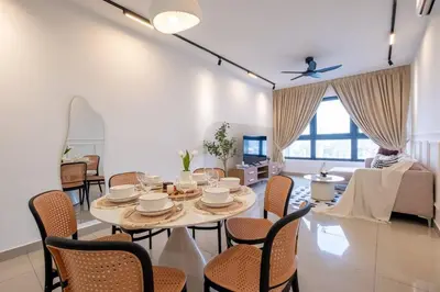 a dining room with a table and chairs and a couch at M Vertica KL City Tower C By Feel Home in Kuala Lumpur