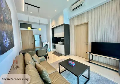 a living room with a couch and a flat screen tv at The Colony BEST SKY Pool View in Kuala Lumpur