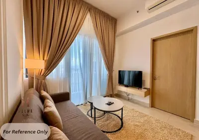 a living room with a couch and a television at The Colony BEST SKY Pool View in Kuala Lumpur