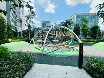 a playground in a park with a swing at Agile Bukit Bintang Suites TRX in Kuala Lumpur