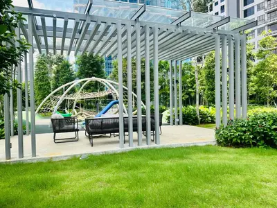 a pergola with a playground in a yard at Agile Bukit Bintang Suites TRX in Kuala Lumpur