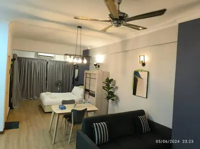 a living room with a couch and a table at 19-16 Casa Mutiara-Sweet Home city view in Kuala Lumpur