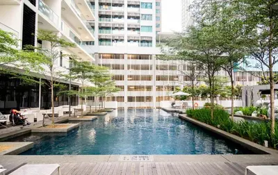 a swimming pool in the middle of a building at 188 Suites KLCC by Premium Suites in Kuala Lumpur