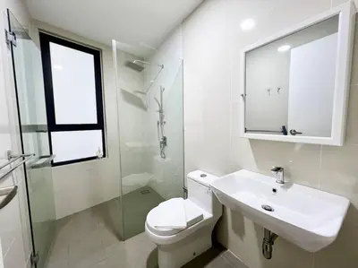 a white bathroom with a toilet and a sink at ContiNeW Pudu nr Ikea Cheras 2Br-6pax-1park-Wi-fi in Kuala Lumpur