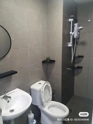 a bathroom with a toilet and a sink at Neu suites 001 cozy studio klcc in Kuala Lumpur