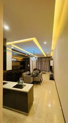 a room with a kitchen and a living room at The Dorsett Residence Service Suite KL in Kuala Lumpur