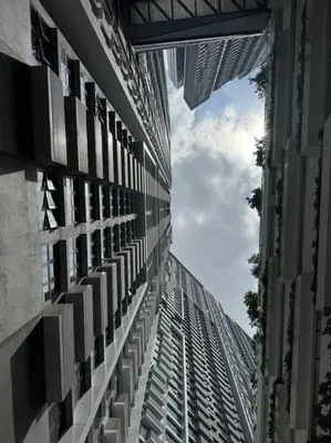 a tall building looking up at the sky at M Vertica Residence in Kuala Lumpur