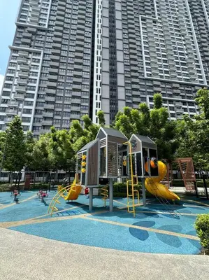 a playground in front of a large building at M Vertica Residence in Kuala Lumpur