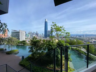 a balcony with a view of a city at CONTINEW Residence - TRX KL in Kuala Lumpur