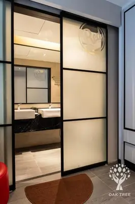 a bathroom with two sinks and two mirrors at The OAK SUITE AT Menara M101 KL in Kuala Lumpur