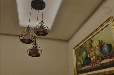 two lights hanging from the ceiling in a room at Dorsett Residences Hartamas in Kuala Lumpur