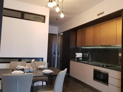 a kitchen and dining room with a table and chairs at Klcc Suites at Twin Tower in Kuala Lumpur
