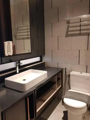 a bathroom with a sink and a toilet at Klcc Suites at Twin Tower in Kuala Lumpur