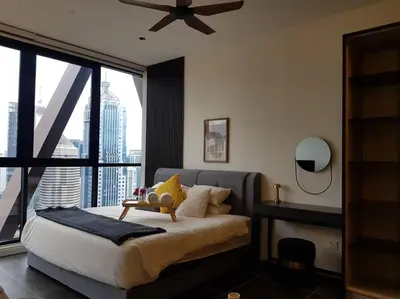 a bedroom with a bed and a large window at Klcc Suites at Twin Tower in Kuala Lumpur