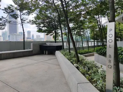 a park with a bench and a sign that reads polo at Robertson to be opened in Kuala Lumpur