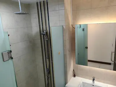 a bathroom with a shower with a sink and a mirror at The Robertson R9 Walk to Jalan Alor Street Bukit Bintang Pavilion 7 pax 2R1B in Kuala Lumpur
