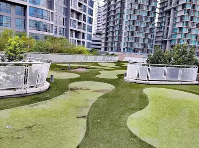 a golf course in the middle of a city with tall buildings at The Robertson R9 Walk to Jalan Alor Street Bukit Bintang Pavilion 7 pax 2R1B in Kuala Lumpur