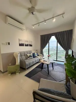 a living room with a couch and a table at The City Edge United Point in Kuala Lumpur