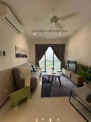 a living room with a couch and a table at The City Edge United Point in Kuala Lumpur