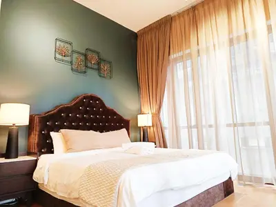 a bedroom with a bed and a large window at 7 Kuala Lumpur City for 4 to 12 PAX of 4 BEDROOMS and 3 BATHROOMS near KLCC in Kuala Lumpur