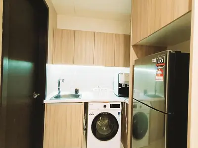 a kitchen with a washing machine and a sink at 7 Kuala Lumpur City for 4 to 12 PAX of 4 BEDROOMS and 3 BATHROOMS near KLCC in Kuala Lumpur