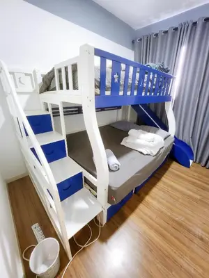 a blue and white bunk bed in a room at Luxury 4 Bedroom Suite at Cheras Maluri MRT in Kuala Lumpur