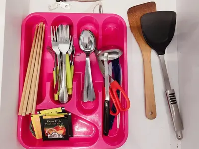 a pink tray with utensils on a table at Luxury 4 Bedroom Suite at Cheras Maluri MRT in Kuala Lumpur