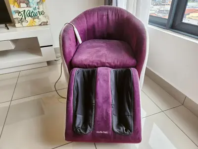 a purple chair with a bag on top of it at Luxury 4 Bedroom Suite at Cheras Maluri MRT in Kuala Lumpur