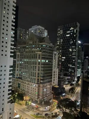 a view of a city at night with tall buildings at Vortex Family suites Apartment in Kuala Lumpur