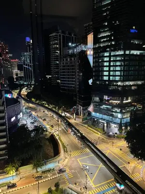 a city at night with a lot of traffic at Vortex Family suites Apartment in Kuala Lumpur