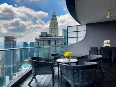 a restaurant with a view of a city skyline at Luxury Penthouse KLCC & KL TOWER View in Kuala Lumpur in Kuala Lumpur