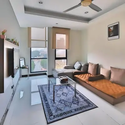 a living room with a couch and a table at Casa Residency Apartments and suites KL in Kuala Lumpur