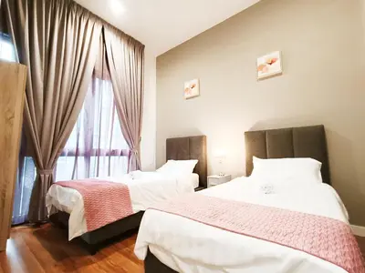 a bedroom with two beds and a window at 8 Kuala Lumpur City for 4 to 10 PAX of 4 BEDROOMS and 3 BATHROOMS near KLCC in Kuala Lumpur