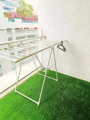 a glass table sitting on top of a green rug at 8 Kuala Lumpur City for 4 to 10 PAX of 4 BEDROOMS and 3 BATHROOMS near KLCC in Kuala Lumpur